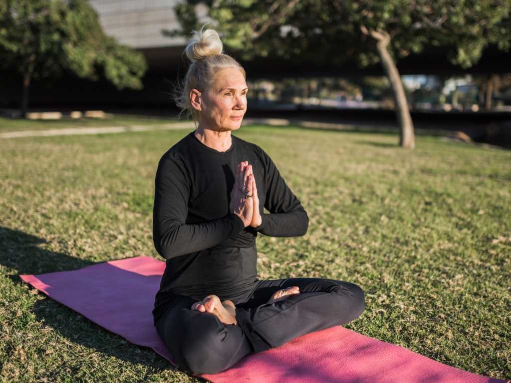 Mature woman demonstrating holistic approach to wellness and beauty