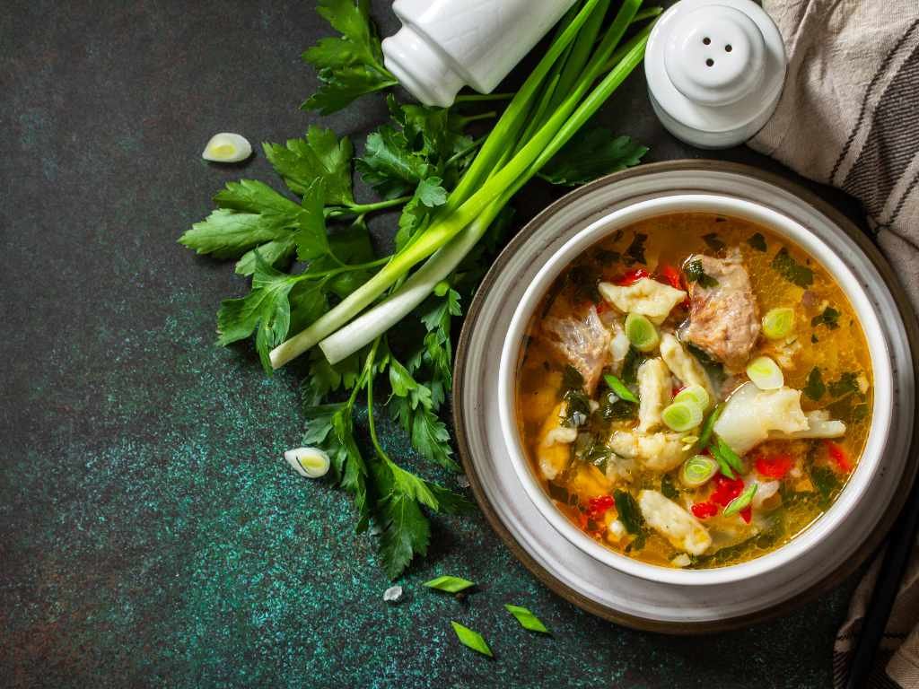 Nutritious homemade soup with vegetables and herbs for daily immunity boosts