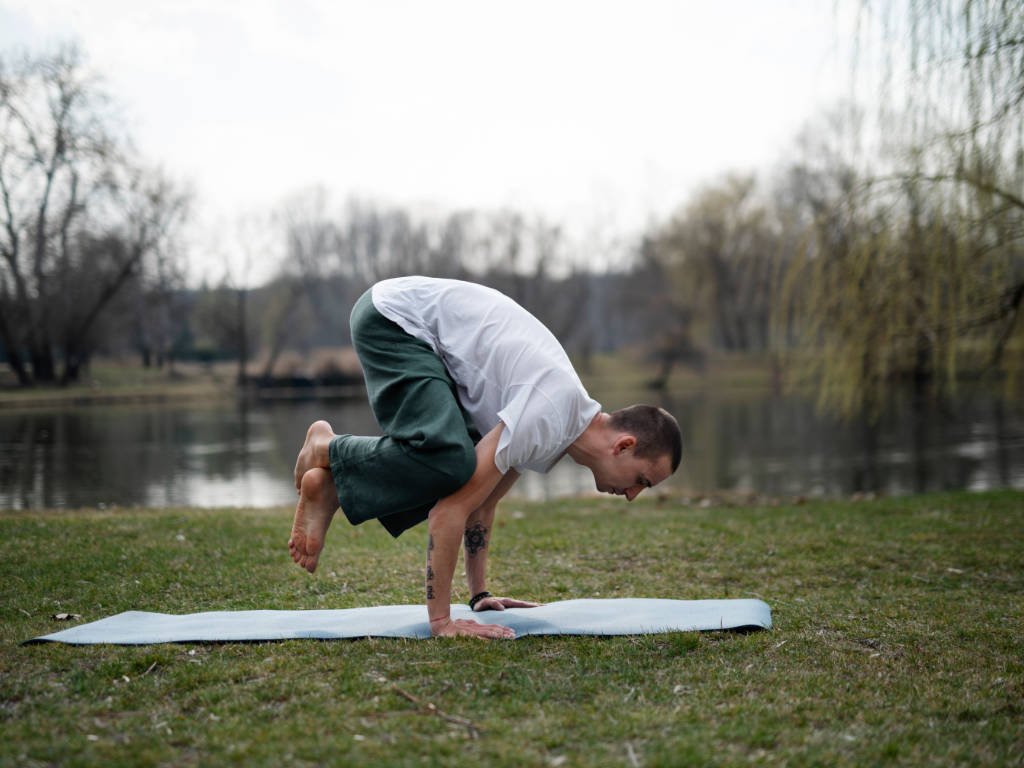 Man practicing yoga outdoors as one of the effective meditation techniques for mindfulness and calm