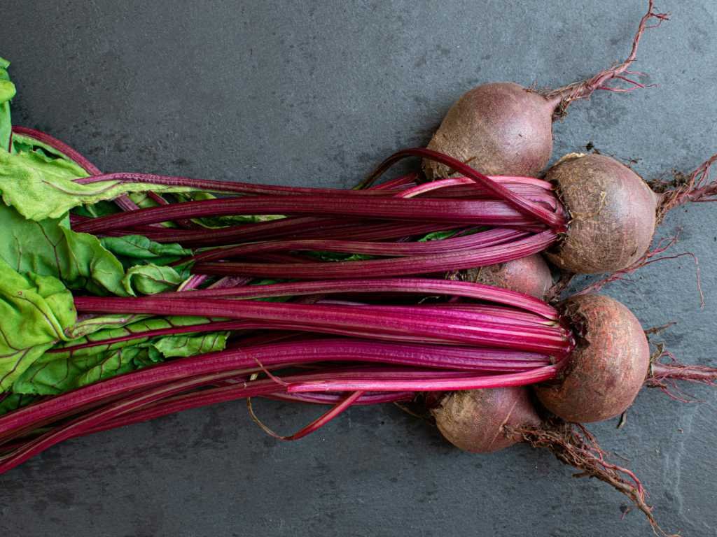 Fresh beetroots with leafy greens - foods for mental clarity that boost blood flow to the brain