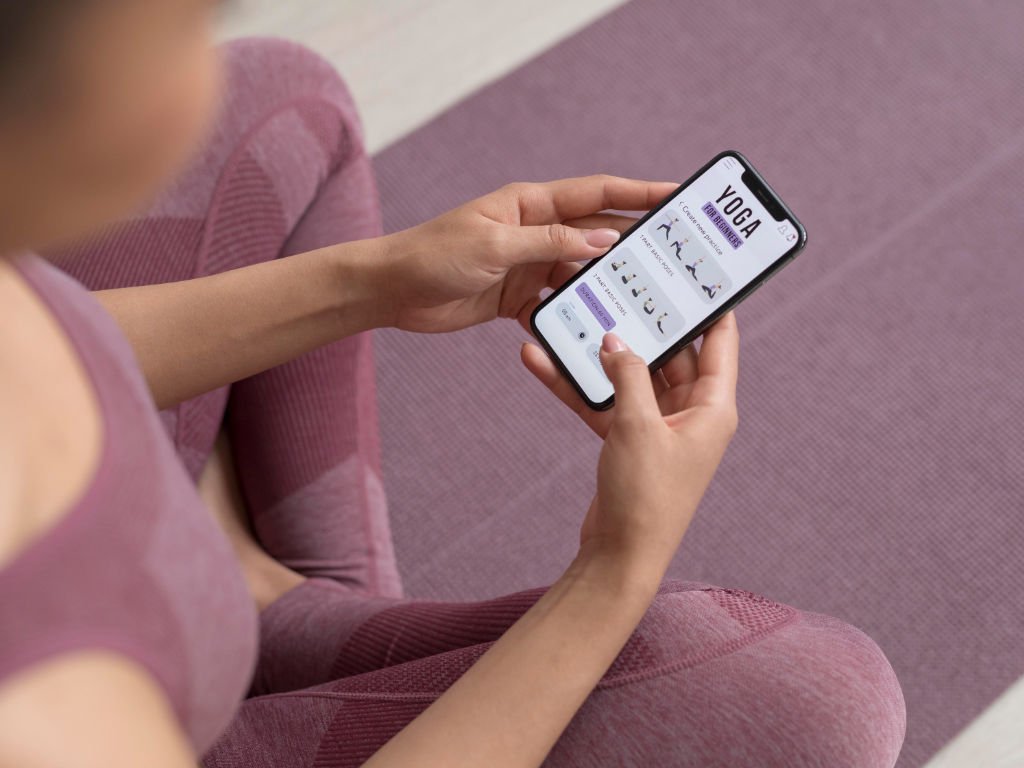 Fitness trends 2025 featuring personalization premium with customized yoga app showing tailored workout recommendations and personal fitness interface