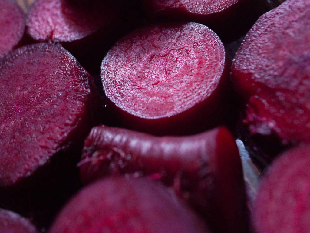 Fresh sliced beets displaying vibrant red color representing antioxidant-rich foods with high betalain content