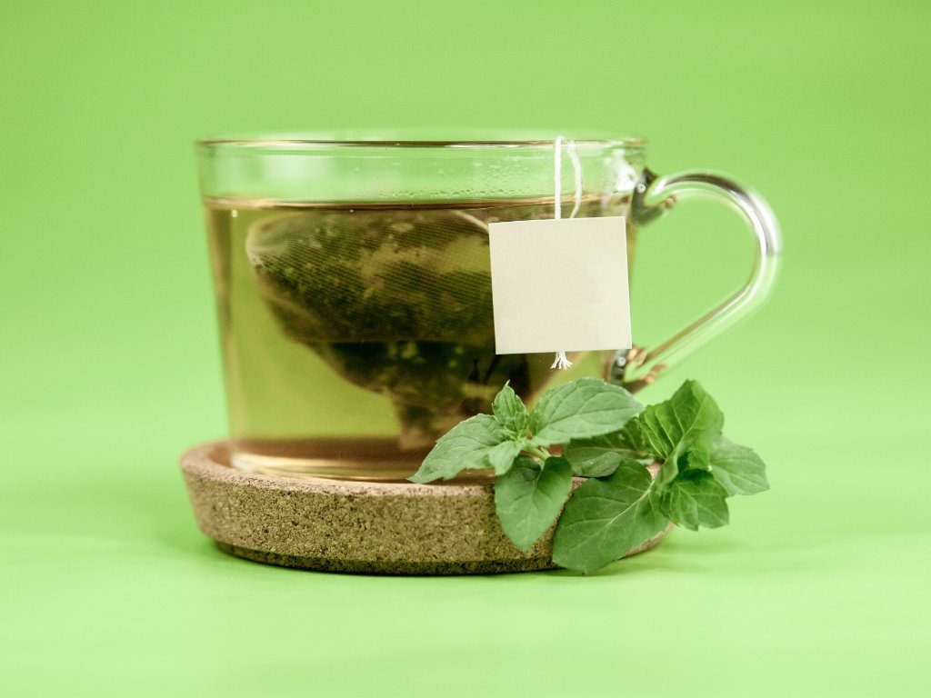 Fresh green tea with mint leaves to boost your metabolism naturally for weight loss and health benefits