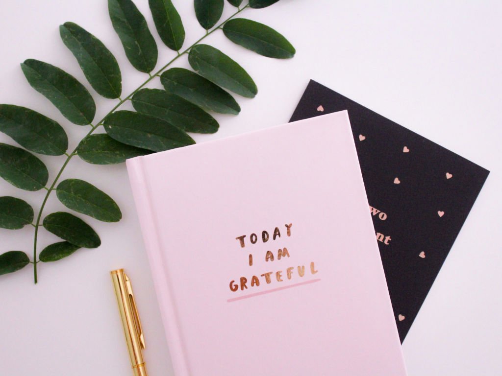 Gratitude journal with positive affirmation message demonstrating mental health strategies for evidence-based positive thinking techniques