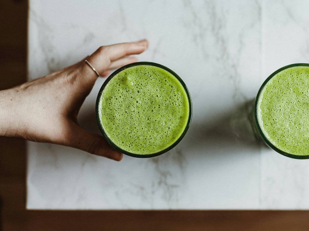Two glasses of green meal replacement shakes for effective weight loss and nutrition support