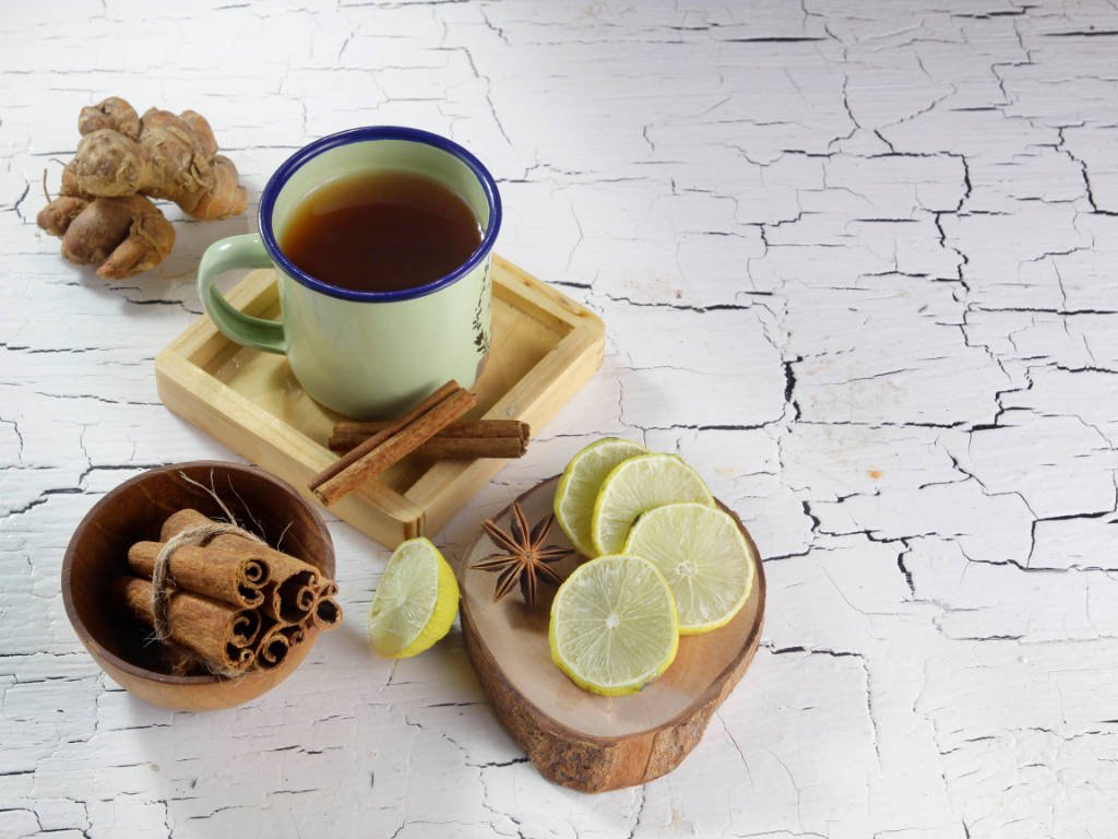 Natural remedies for fat loss showing powerful herbal allies including ginger, cinnamon sticks, and metabolism-boosting tea for weight management