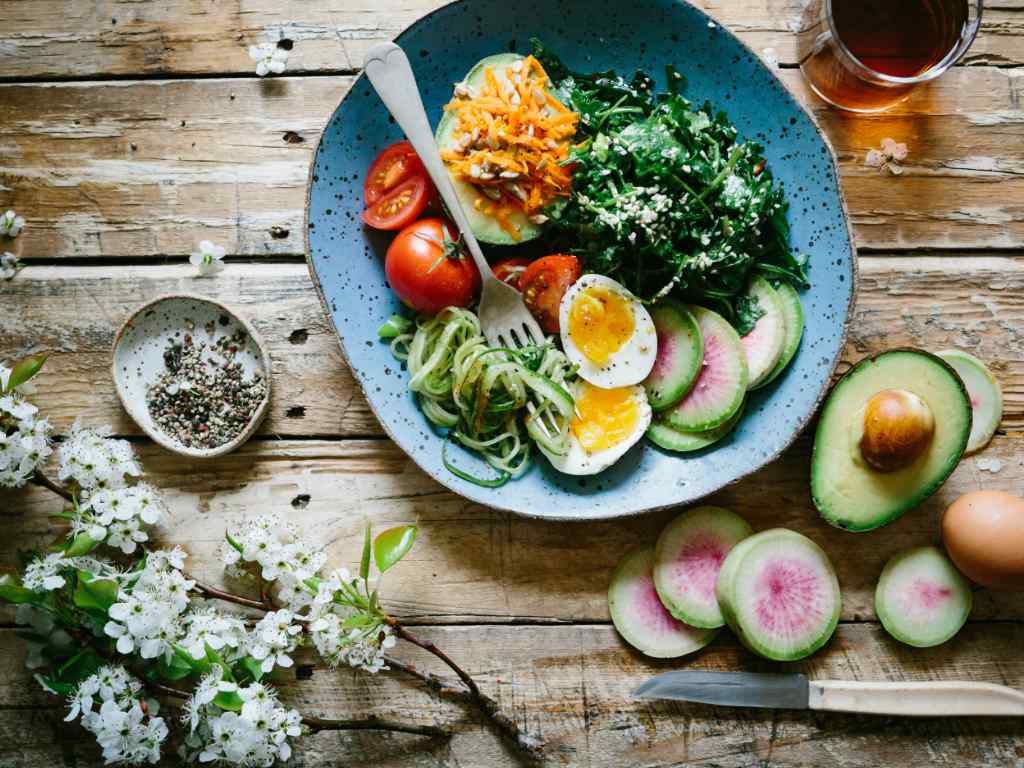 Artfully composed nutritious meal bowl demonstrating strategic diet planning for achieving specific fitness goals with balanced macronutrients