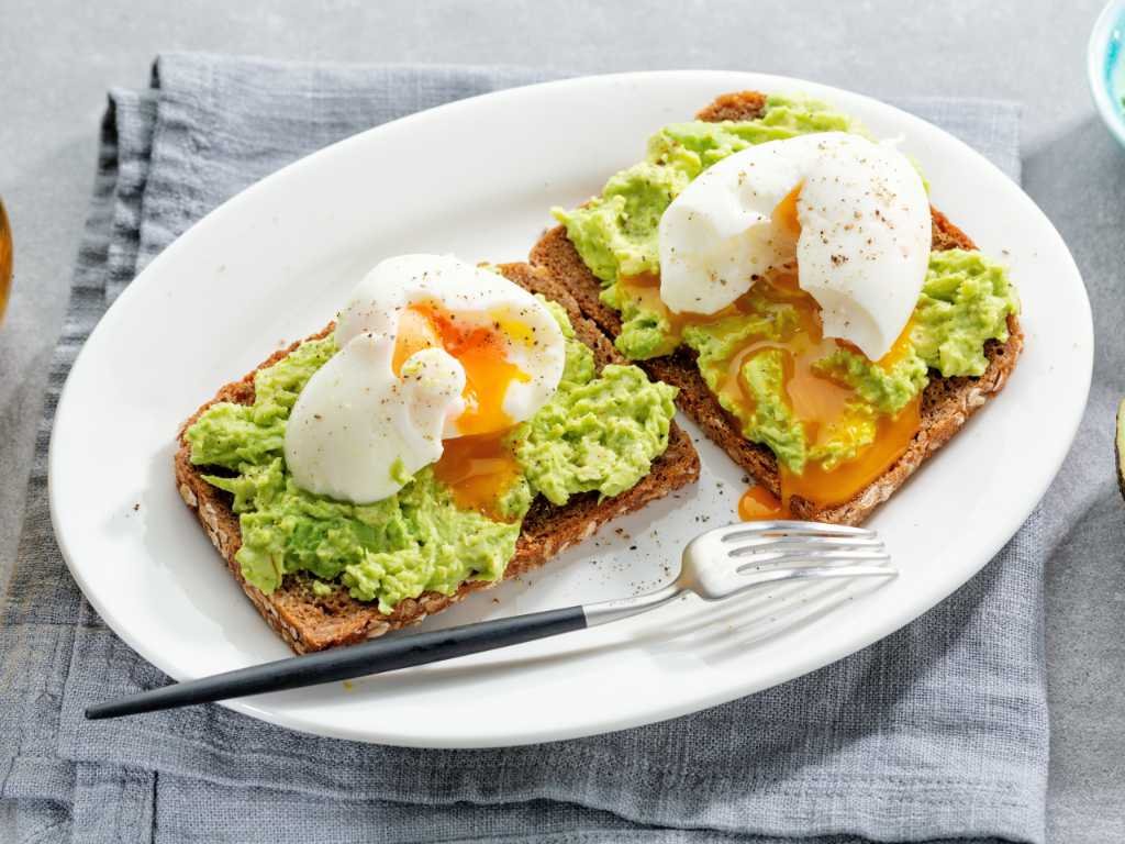 Nutritious avocado toast with poached eggs as part of effective post-exercise routines for optimal recovery nutrition