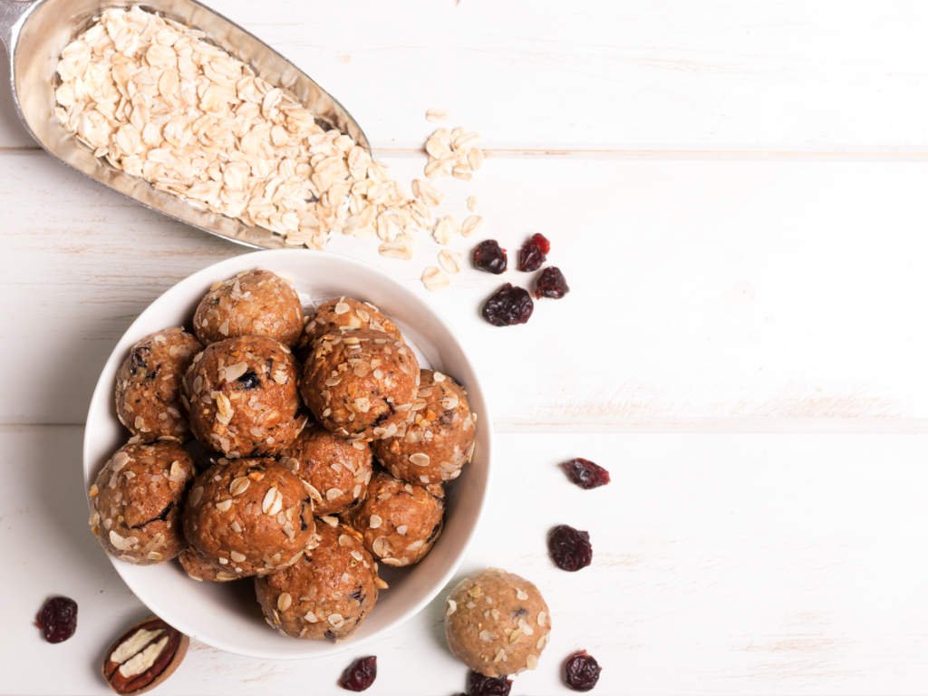Homemade almond butter energy bites with oats and cranberries - nutritious plant-based protein snacks for sustained energy and muscle recovery