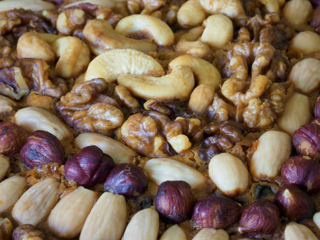 Mixed nuts including walnuts, cashews, almonds and hazelnuts - key ingredients for antioxidant snacks like trail mix for active individuals